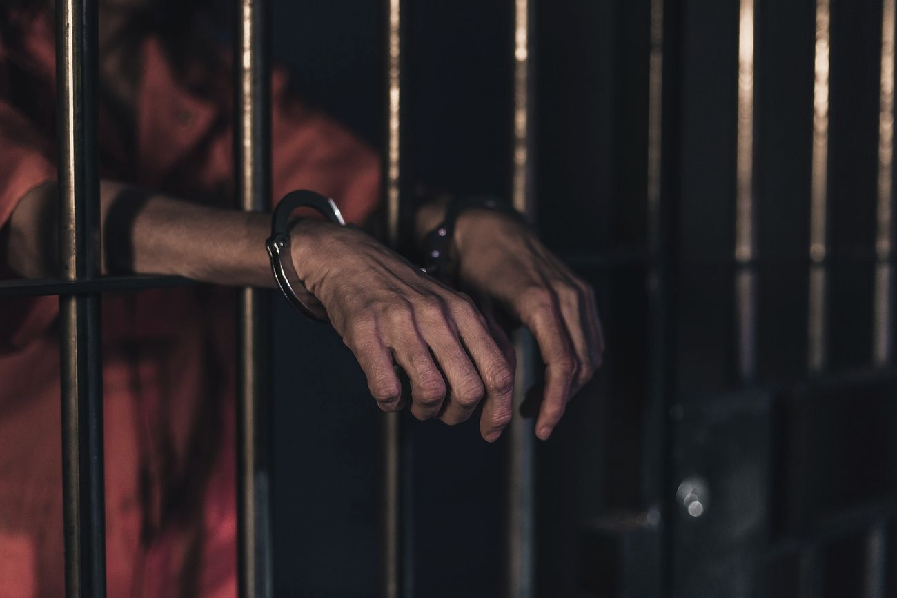 Free person with handcuffed in prison